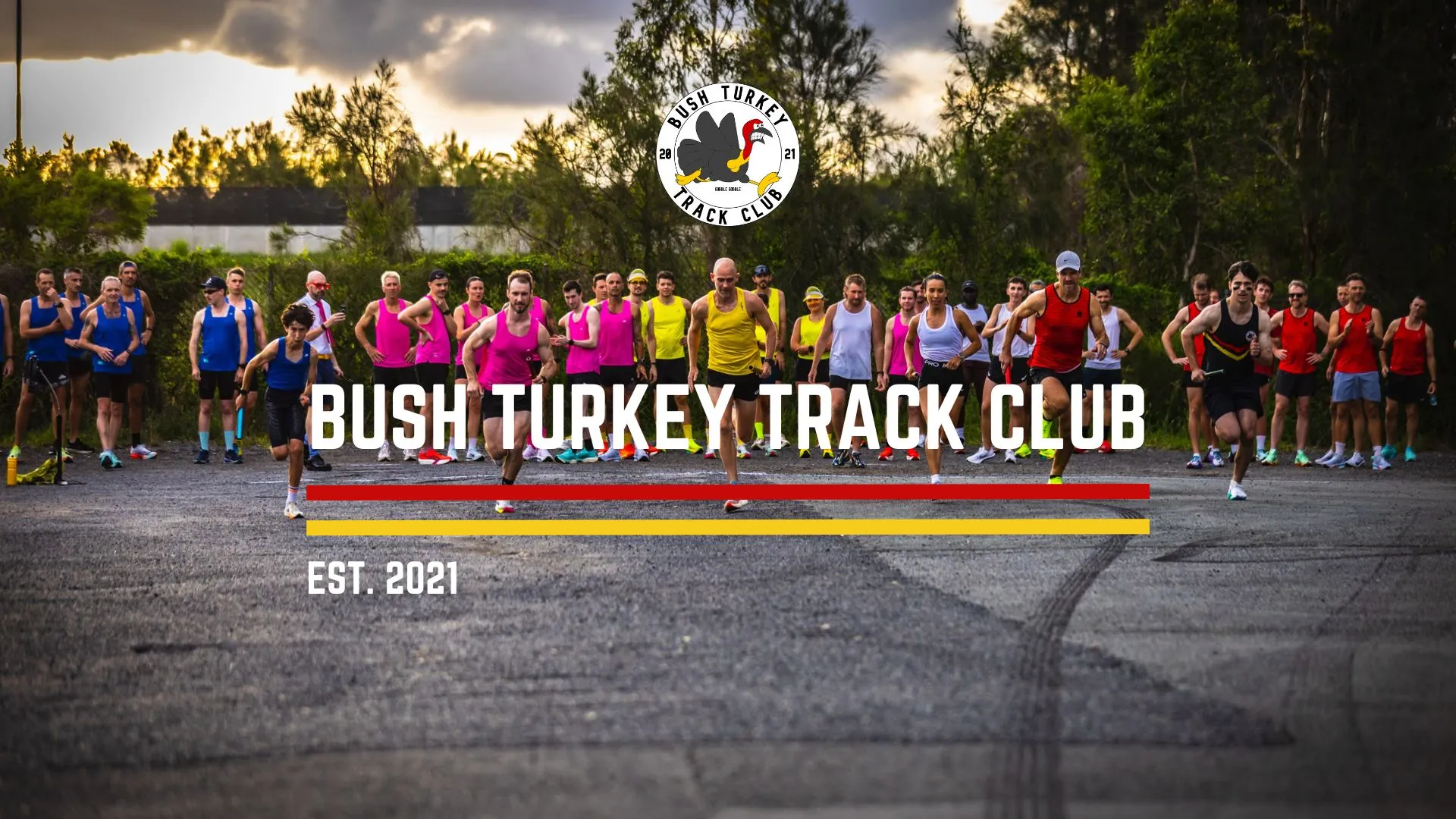 Bush Turkey Track Club members sprinting off the start line at Deagon, under the club logo and the title Bush Turkey Track Club, established 2021